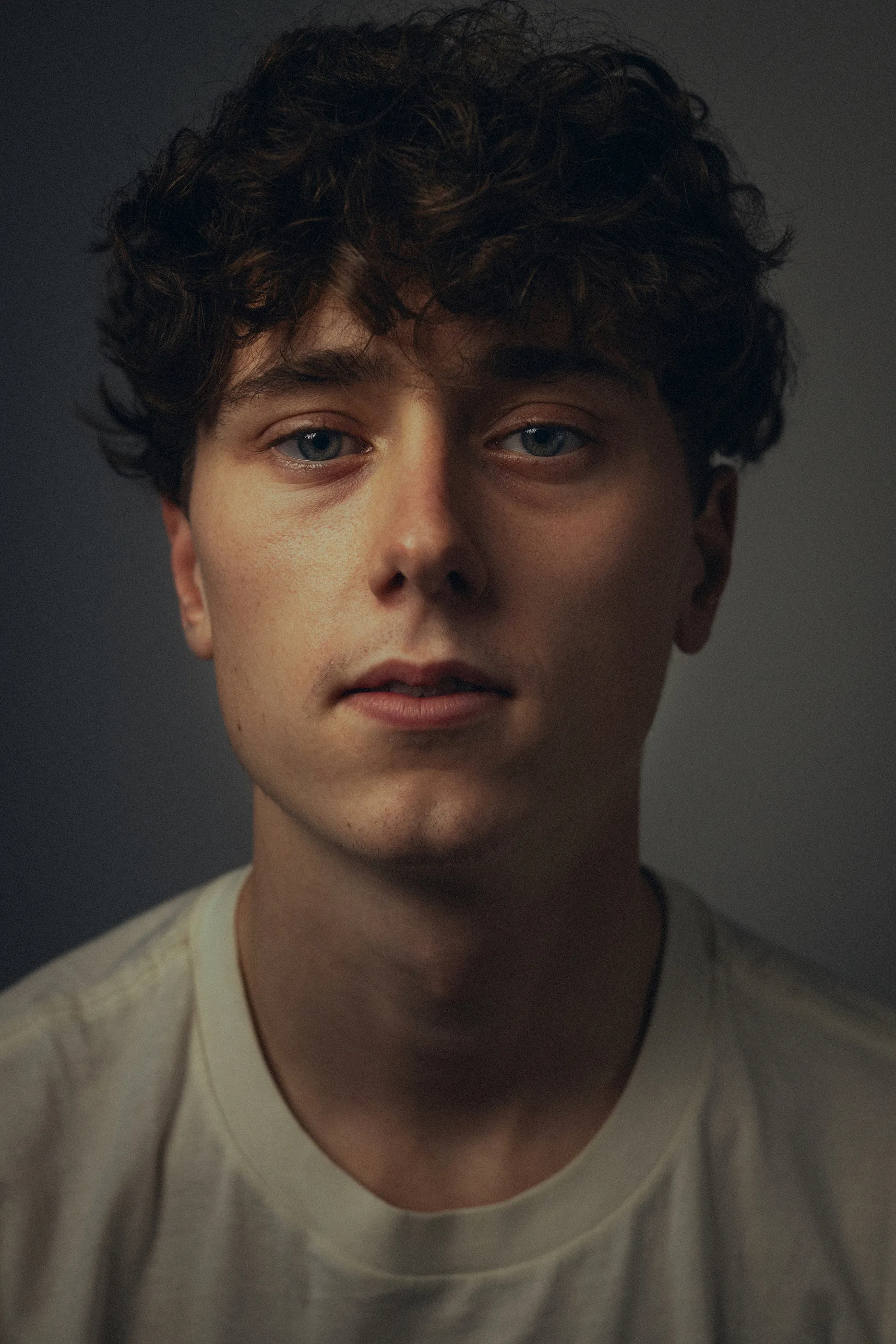 portrait of man with neutral expression.